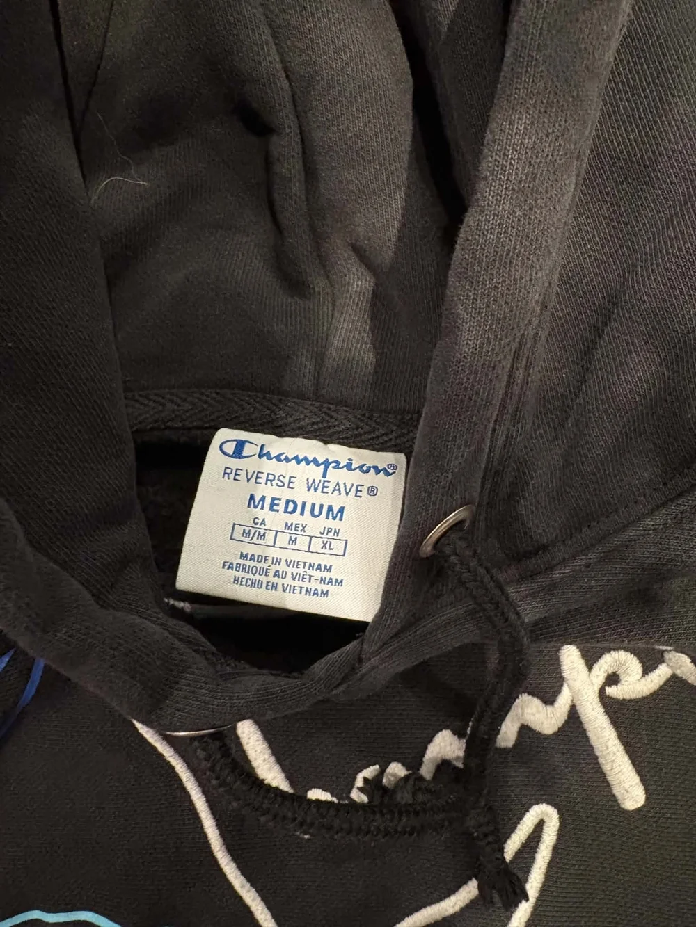 Champion Black Hoodie with Graphic Logo and Red Accent